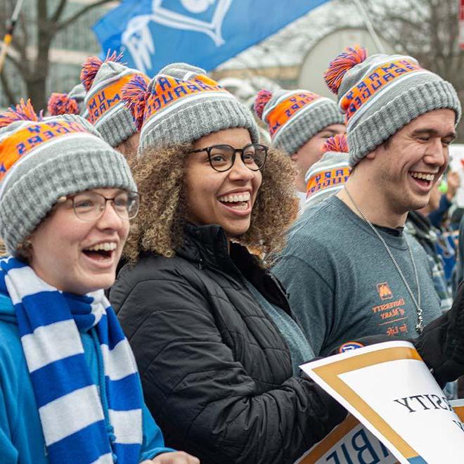 Joyful University of Mary students wearing matching stocking caps at the national March for Life event in Washington D.C.